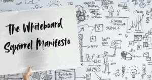 Whiteboard filled with scribbles and a lightbulb sketch held up with the text “The Whiteboard Squirrel Manifesto” overlaid