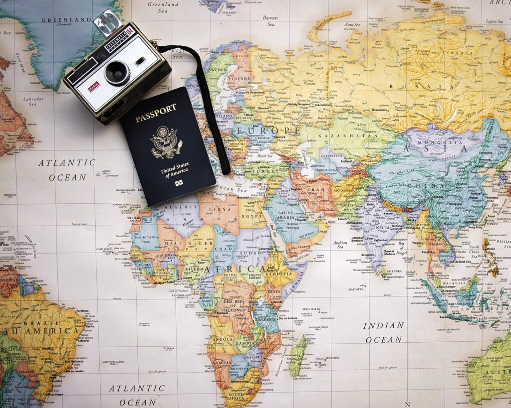 Flat lay of a passport placed on a world map