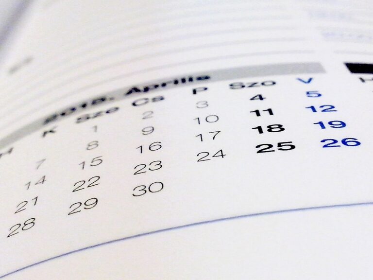 A soft-focus photo of a monthly calendar, representing building a blog post queue and planning ahead with breathing room